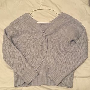 Light blue, grayish sweater with cut out. Size small in perfect condition.
